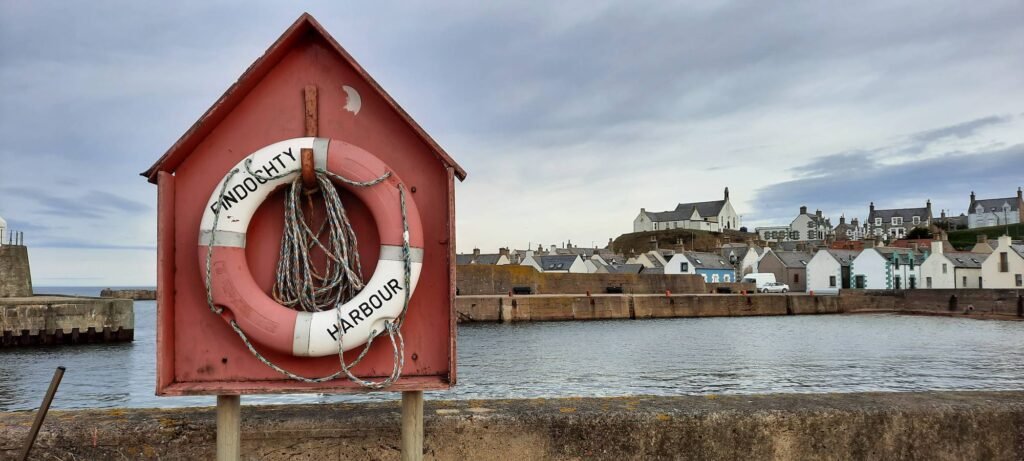 Findochty Harbour lifebuoy and waterfront.
